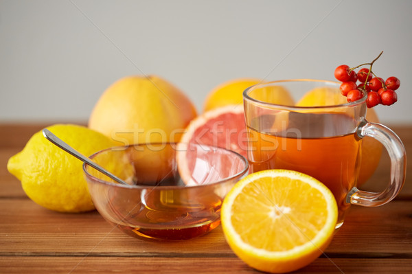 tea with honey, lemon and rowanberry on wood Stock photo © dolgachov