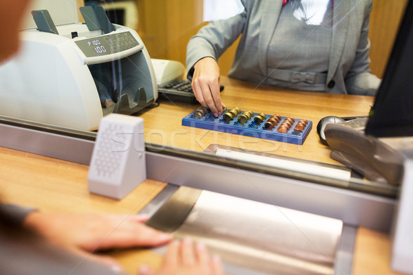 clerk counting cash money at bank office Stock photo © dolgachov