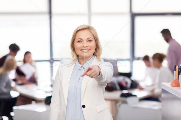 smiling businesswoman at office Stock photo © dolgachov