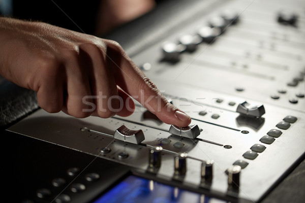 hand with mixing console in music recording studio Stock photo © dolgachov