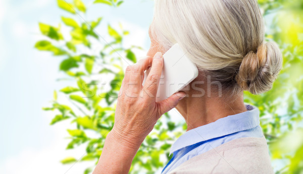 close up of senior woman calling on smartphone Stock photo © dolgachov
