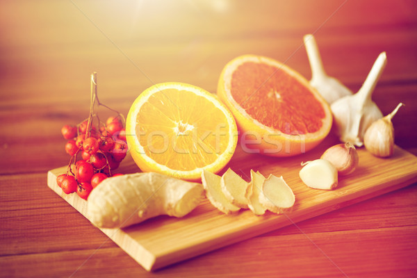 citrus, ginger, garlic and rowanberry on wood Stock photo © dolgachov