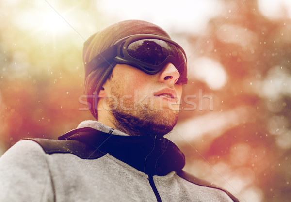 sports man with ski goggles in winter outdoors Stock photo © dolgachov