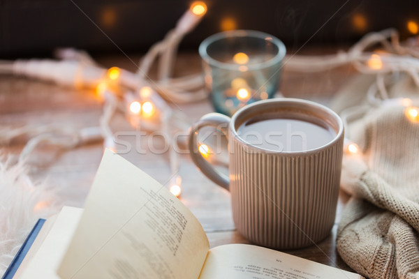 book and cup of coffee or hot chocolate on table Stock photo © dolgachov