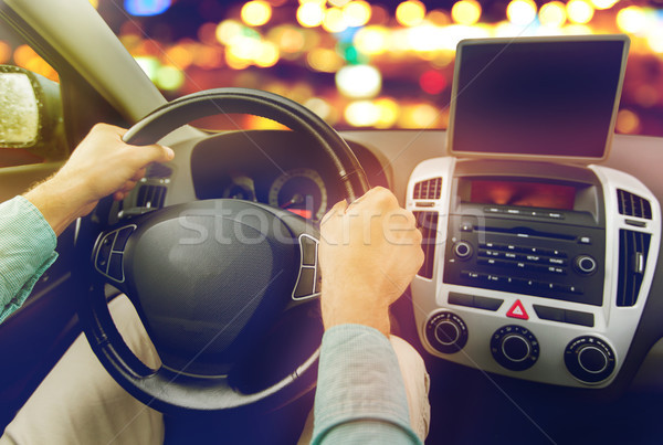 close up of young man with tablet pc driving car Stock photo © dolgachov