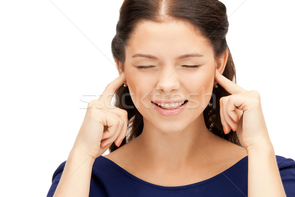 Stock photo: woman with fingers in ears