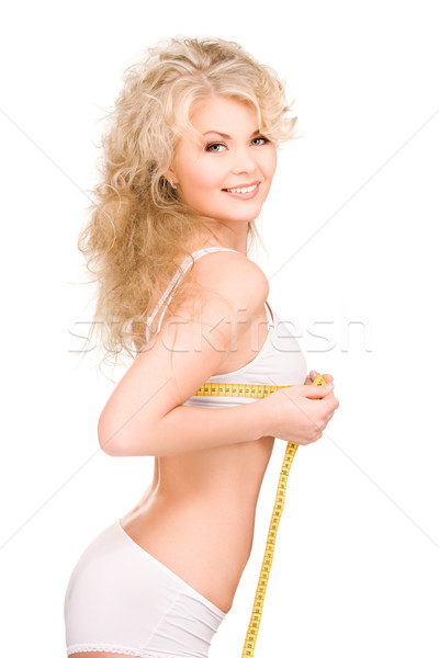 Fiatal gyönyörű nő mérőszalag fehér nő szexi Stock fotó © dolgachov