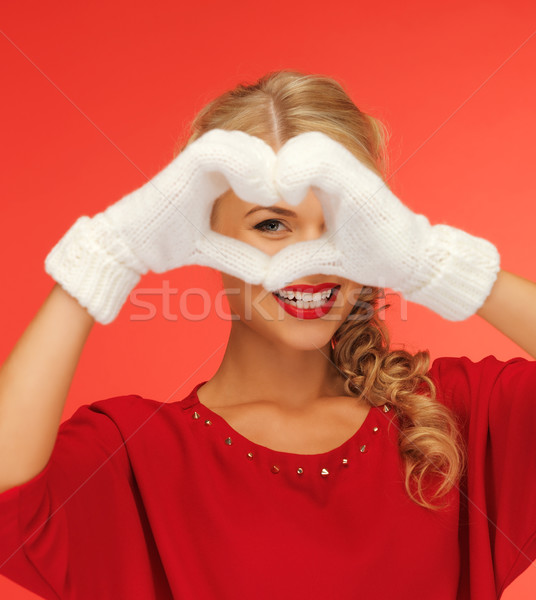 lovely woman showing heart shape Stock photo © dolgachov