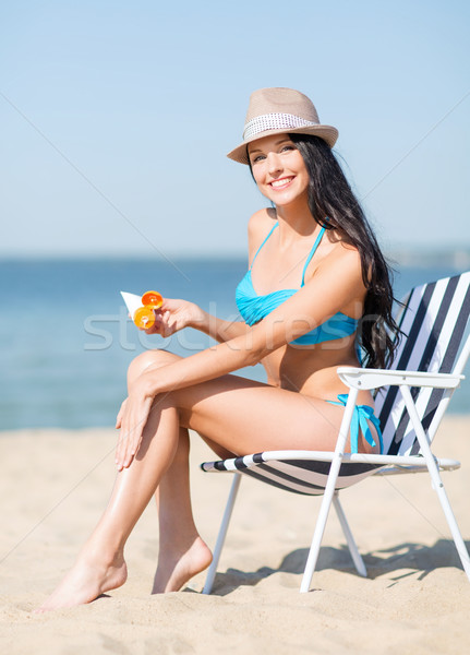 girl sunbathing on the beach chair Stock photo © dolgachov