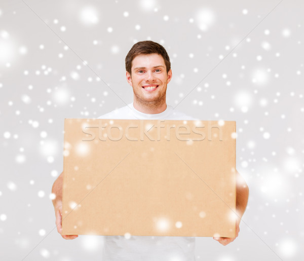 smiling man carrying carton box Stock photo © dolgachov