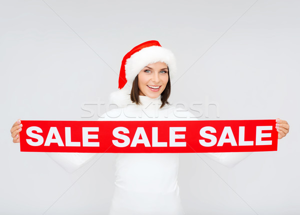 Kobieta Święty mikołaj pomocnik hat czerwony sprzedaży Zdjęcia stock © dolgachov