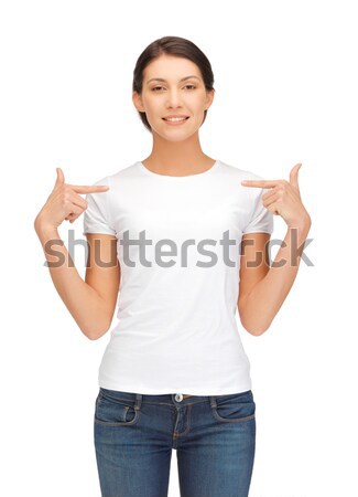Souriant petite fille blanche tshirt design pointant [[stock_photo]] © dolgachov