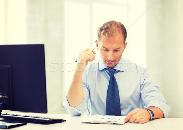 Stock photo: businessman writing in notebook