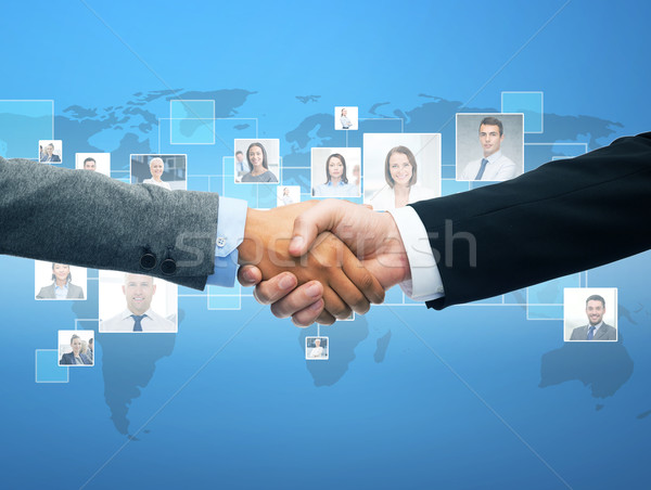 Stock photo: businessman and businesswoman shaking hands