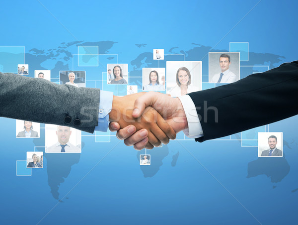 businessman and businesswoman shaking hands Stock photo © dolgachov