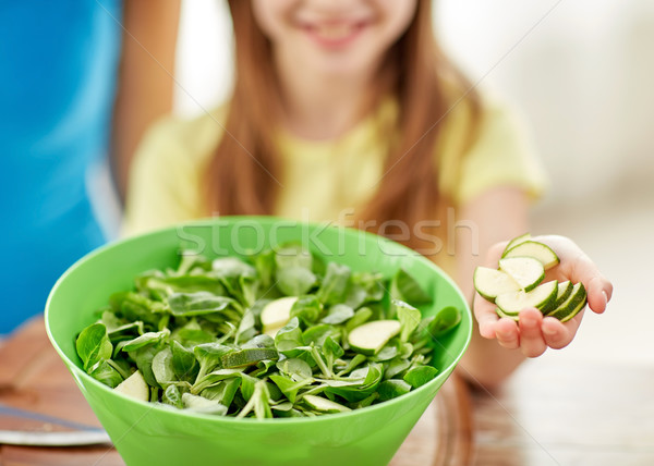 close up of happy family making dinner in kitchen Stock photo © dolgachov