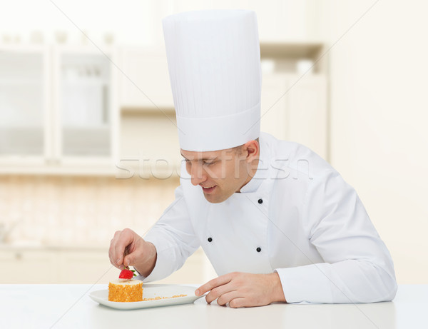 happy male chef cook decorating dessert Stock photo © dolgachov
