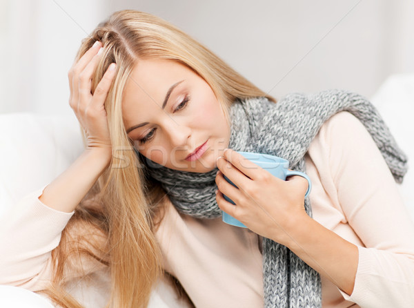 diseased woman with cup of tea Stock photo © dolgachov