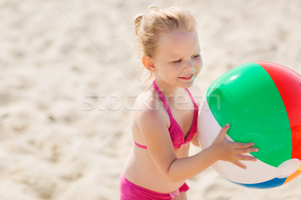 happy little girl playing inflatable ball on beach Stock photo © dolgachov