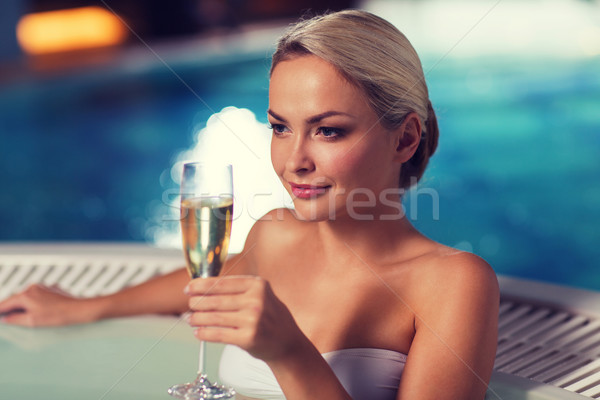 happy woman drinking champagne at swimming pool Stock photo © dolgachov