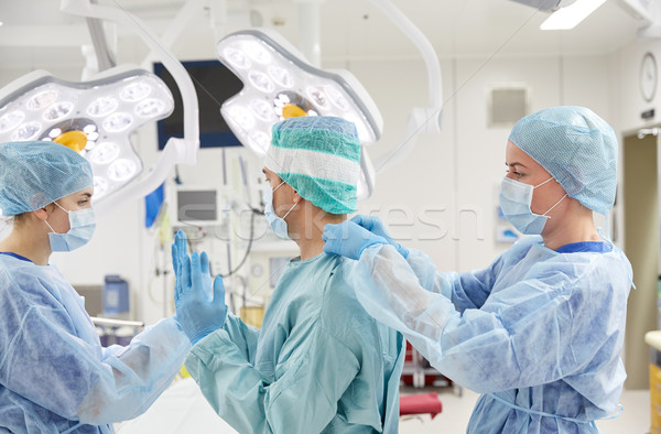 surgeons in operating room at hospital Stock photo © dolgachov