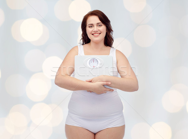 Szczęśliwy młodych plus size kobieta skali Zdjęcia stock © dolgachov
