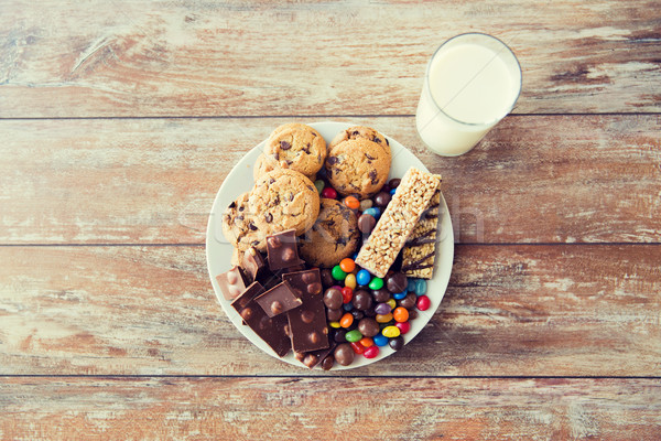 close up of sweet food and milk glass on table Stock photo © dolgachov