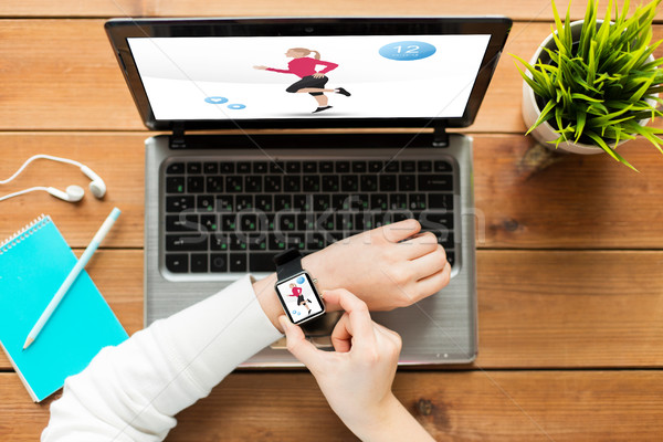 close up of woman with smart watch and laptop Stock photo © dolgachov