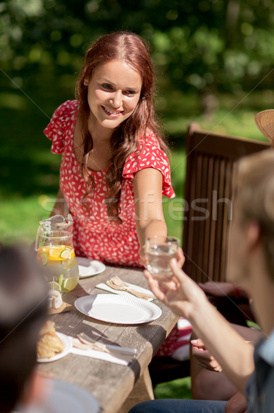 happy friends having dinner at summer garden party Stock photo © dolgachov