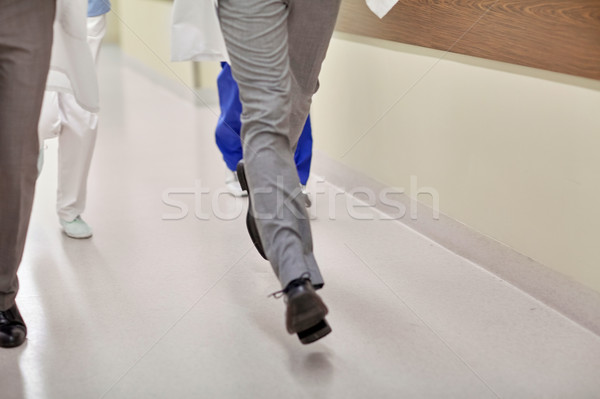 close up of medics or doctors running at hospital Stock photo © dolgachov