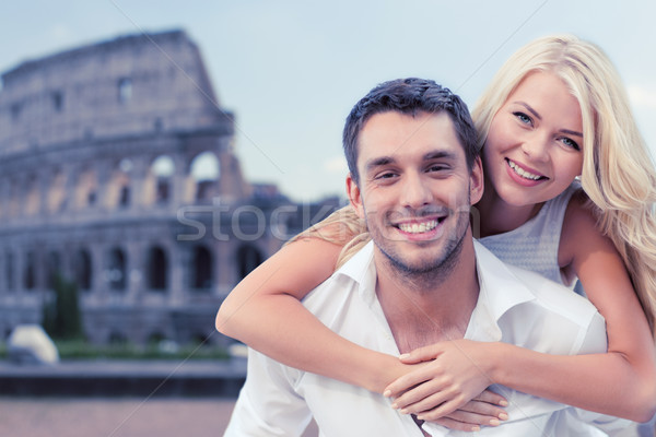 happy couple hugging over coliseum Stock photo © dolgachov