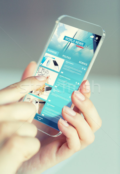 Vrouw nieuws smartphone business Stockfoto © dolgachov