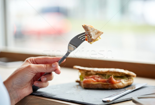 женщину еды лосося Панини сэндвич Сток-фото © dolgachov