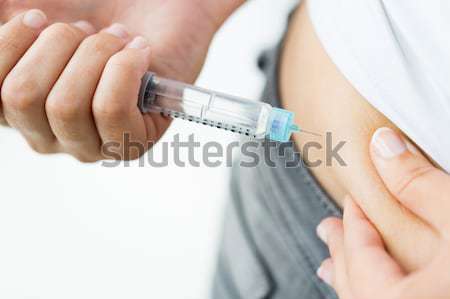 Om seringă insulina injecţie medicină Imagine de stoc © dolgachov
