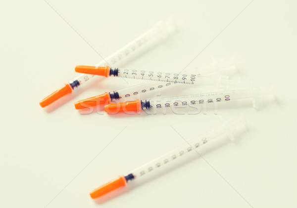 close up of insulin syringes on table Stock photo © dolgachov