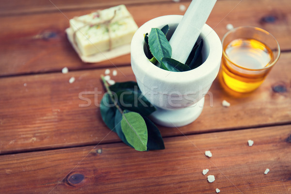 close up of mortar with leaves on wood Stock photo © dolgachov