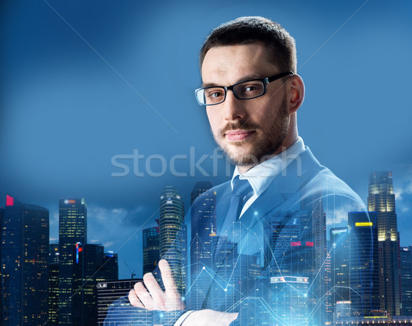 businessman in glasses over night singapore city Stock photo © dolgachov