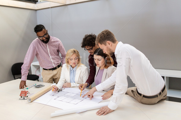 business team discussing house project at office Stock photo © dolgachov