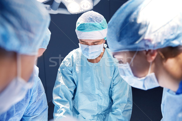 group of surgeons in operating room at hospital Stock photo © dolgachov