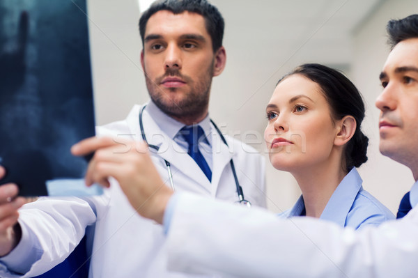 Stock photo: group of medics with spine x-ray scan at hospital