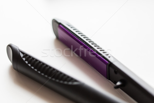 close up of flat hair straightening iron Stock photo © dolgachov