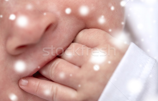 close up of baby sucking his fingers Stock photo © dolgachov