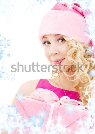 santa helper in corset and skirt with pink gift box Stock photo © dolgachov