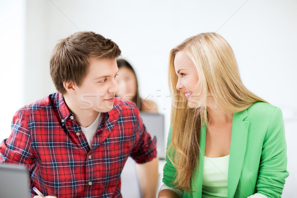 smiling students looking at each other at school Stock photo © dolgachov