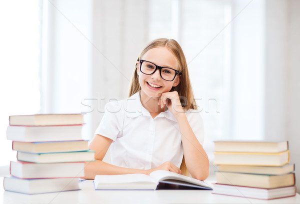 student girl studying at school Stock photo © dolgachov