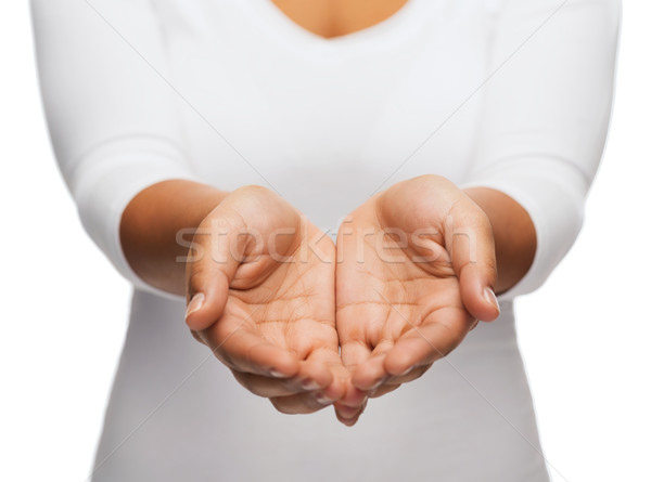 womans cupped hands showing something Stock photo © dolgachov