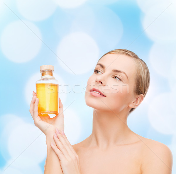 Mujer petróleo botella spa belleza cara Foto stock © dolgachov