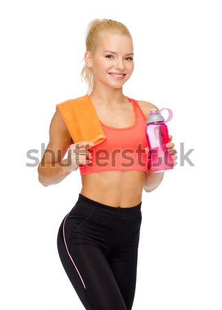 Souriant femme une bouteille d'eau serviette sport [[stock_photo]] © dolgachov