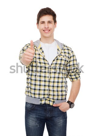 smiling student boy showing thumbs up Stock photo © dolgachov