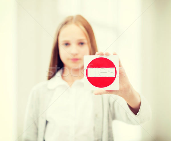 girl showing no entry sign Stock photo © dolgachov